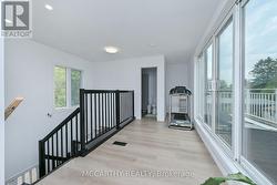 open hall way with wall of windows - 