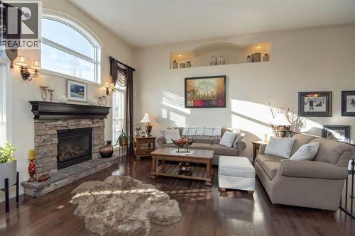 15 Volk Place, Red Deer, AB - Indoor Photo Showing Living Room With Fireplace