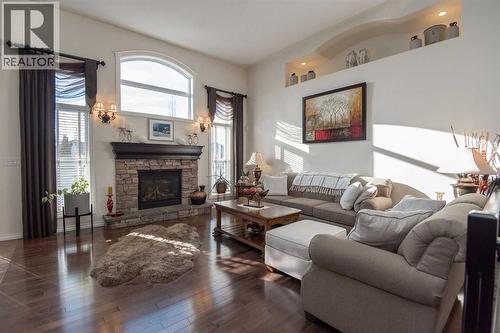 15 Volk Place, Red Deer, AB - Indoor Photo Showing Living Room With Fireplace