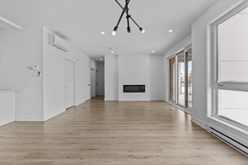 Salon - 105-13225 Boul. Du Curé-Labelle, Mirabel, QC - Indoor Photo Showing Other Room With Fireplace