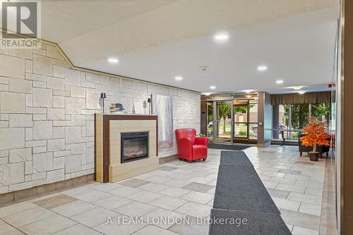 407 - 155 Kent Street, London East (East F), ON - Indoor Photo Showing Other Room With Fireplace