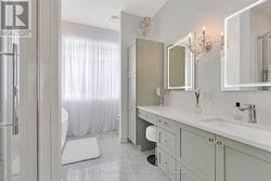 Primary ensuite quartz vanity & touchlight mirrors - 