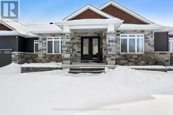 Elegant front Cortona stone & Maibec siding - 