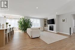 Modern hardwood flooring and pot lights - 