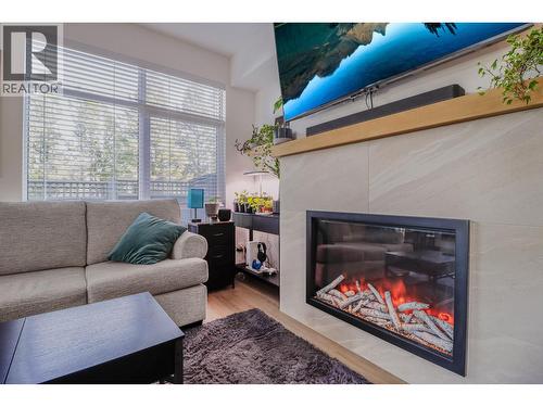 703 15A Crescent Unit# 15, Invermere, BC - Indoor Photo Showing Living Room With Fireplace