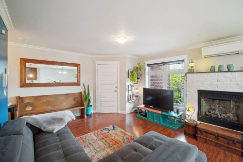 Living Room - 201-9108 Rue Notre-Dame E., Montréal (Mercier/Hochelaga-Maisonneuve), QC - Indoor Photo Showing Living Room With Fireplace