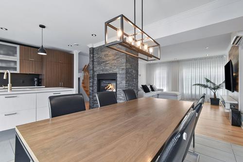Salle à manger - 20260 Rue De Nevers, Mirabel, QC - Indoor Photo Showing Dining Room With Fireplace