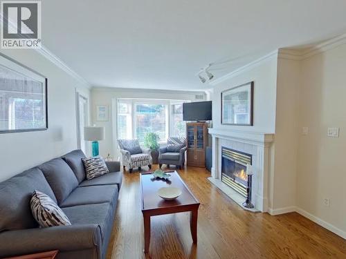 104-4685 Joyce Ave, Powell River, BC - Indoor Photo Showing Living Room With Fireplace