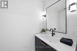 Powder Room off of the Mudroom - Main Floor - 