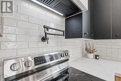 Tiled Backsplash and Pot filler above Stove - 