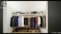 Virtually Staged Closet - Bedroom 1 - 