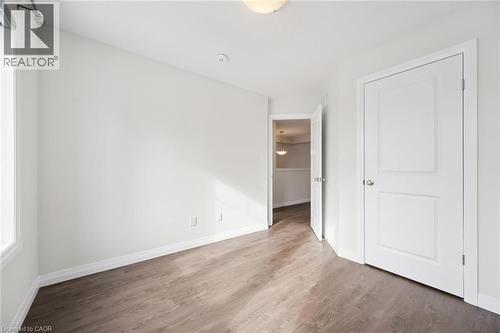 Primary bedroom accommodates queen size bed - 24 Morrison Road Unit# D10, Kitchener, ON - Indoor Photo Showing Other Room