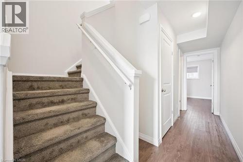 Carpeted staircase to second level - 24 Morrison Road Unit# D10, Kitchener, ON - Indoor Photo Showing Other Room