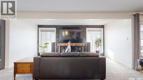 8507 Kestral Drive, Regina, SK - Indoor Photo Showing Living Room With Fireplace