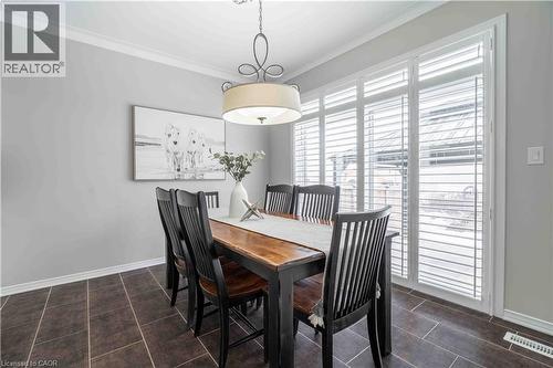 Inviting view of dining area facing the transomed patio doors to provide easy access to yard and view beyond. - 115 Larry Crescent, Caledonia, ON - Indoor Photo Showing Dining Room