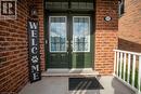 Entrance to property featuring double french doors, transon on covered porch. - 115 Larry Crescent, Caledonia, ON  - Outdoor 