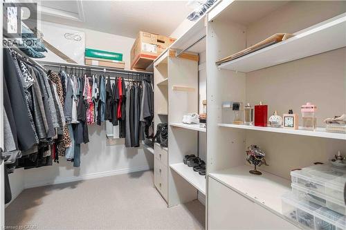 Walk in closet featuring  lots of shelving and organizing opportunities, light carpet - 115 Larry Crescent, Caledonia, ON - Indoor With Storage