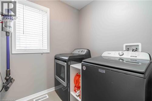 Washroom featuring baseboards and separate washer and dryer - 115 Larry Crescent, Caledonia, ON - Indoor Photo Showing Laundry Room