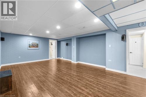 Finished below grade area with recessed lighting, brick wall, dark wood finished floors, and a paneled ceiling - 368 Upper Kenilworth Avenue, Hamilton, ON - Indoor
