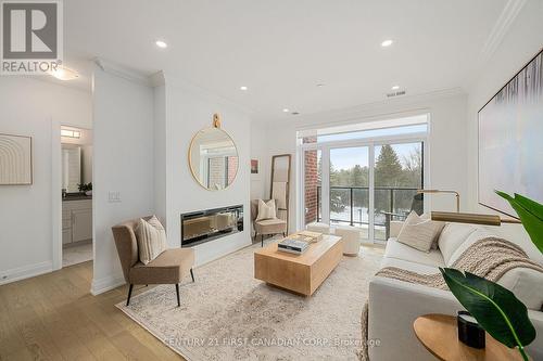 308 - 1560 Upper West Avenue, London South (South B), ON - Indoor Photo Showing Living Room With Fireplace