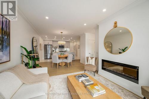 308 - 1560 Upper West Avenue, London South (South B), ON - Indoor Photo Showing Living Room With Fireplace