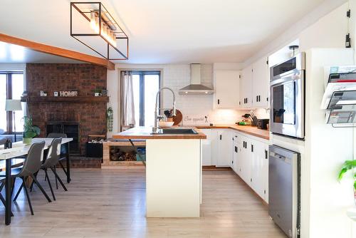 Kitchen - 8100 Route Des Ormes, Bécancour, QC - Indoor Photo Showing Other Room With Fireplace