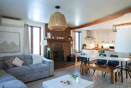Dining room - 8100 Route Des Ormes, Bécancour, QC - Indoor Photo Showing Living Room With Fireplace