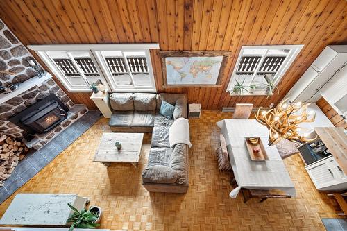 Mezzanine - 2028 Rue De Chandolin, Val-David, QC - Indoor Photo Showing Living Room With Fireplace