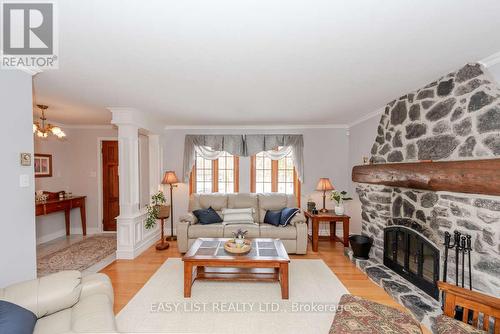 704 Pattee Road, Champlain, ON - Indoor Photo Showing Living Room With Fireplace