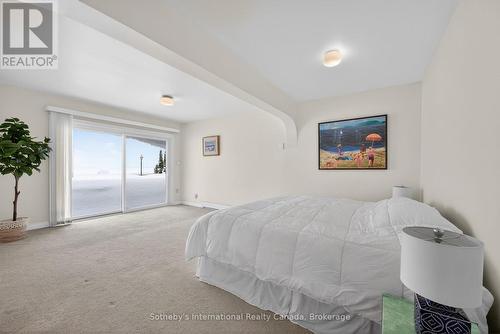 Second primary bedroom on in-between level - 1420 Tiny Beaches Road N, Tiny, ON - Indoor Photo Showing Bedroom