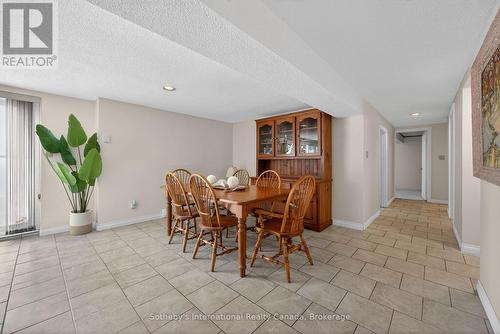 Lower level dining nook w/walkout - 1420 Tiny Beaches Road N, Tiny, ON - Indoor Photo Showing Dining Room