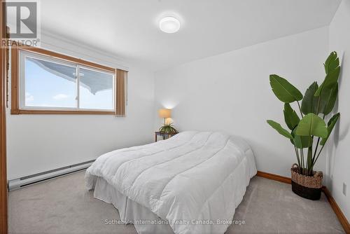 Main level 2nd bedroom facing water - 1420 Tiny Beaches Road N, Tiny, ON - Indoor Photo Showing Bedroom