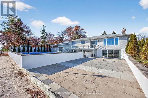 Walk-out from the lower level to the beach & pool - 1420 Tiny Beaches Road N, Tiny, ON - Outdoor