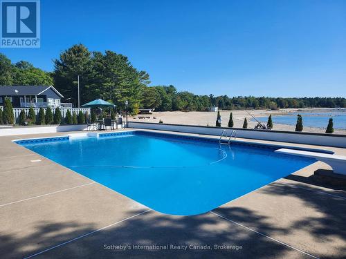 Diving board, ladder & auto pool cleaner included - 1420 Tiny Beaches Road N, Tiny, ON - Outdoor With In Ground Pool