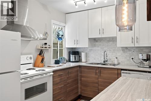 215 Ash Street E, Saskatoon, SK - Indoor Photo Showing Kitchen With Double Sink
