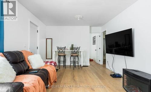 101 River Road E, Wasaga Beach, ON - Indoor Photo Showing Living Room With Fireplace