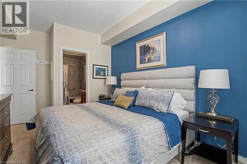 Features walk-in closet - 2000 Creekside Drive Unit# 708, Hamilton, ON - Indoor Photo Showing Bedroom