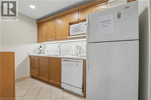 Common kitchen area for your private events - 2000 Creekside Drive Unit# 708, Hamilton, ON - Indoor Photo Showing Kitchen