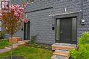 Contemporary facade featuring dark gray textured block siding - 86 Birge Street, Hamilton, ON  - Outdoor 