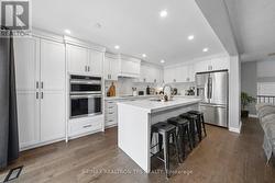 quartz backsplash, built in s/s appliances - 