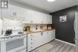 Backsplash, Dishwasher and lots of cabinets - 