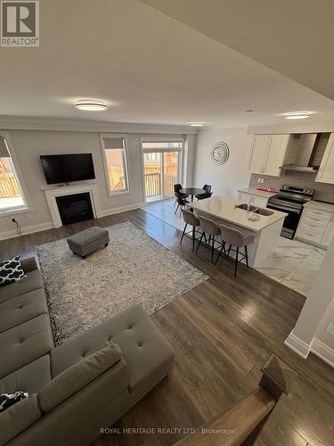 65 Conarty Crescent E, Whitby, ON - Indoor With Fireplace