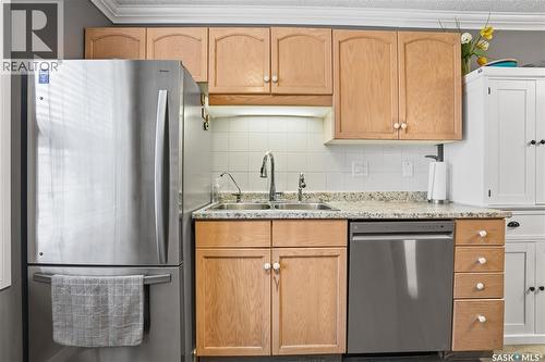 83 Carter Crescent, Regina, SK - Indoor Photo Showing Kitchen With Double Sink