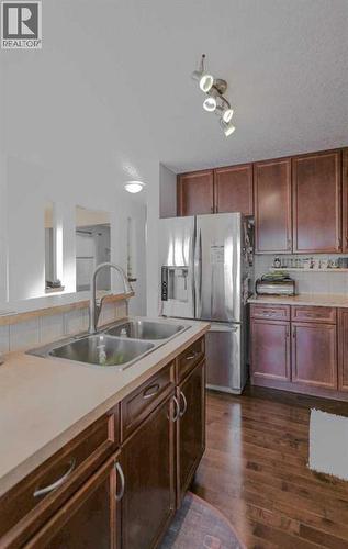 125 Silverado Range Cove Sw, Calgary, AB - Indoor Photo Showing Kitchen With Double Sink