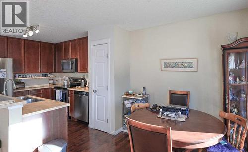 125 Silverado Range Cove Sw, Calgary, AB - Indoor Photo Showing Kitchen With Double Sink