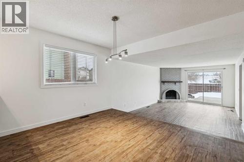 220 Templeby Place Ne, Calgary, AB - Indoor With Fireplace