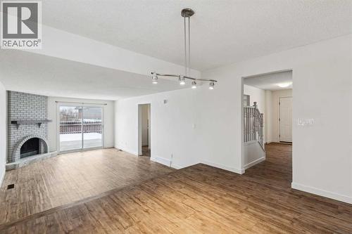 220 Templeby Place Ne, Calgary, AB - Indoor With Fireplace