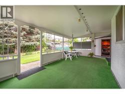 Image shows Sunroom Exit to the Fenced Backyard & Entrance to the Workshop - 