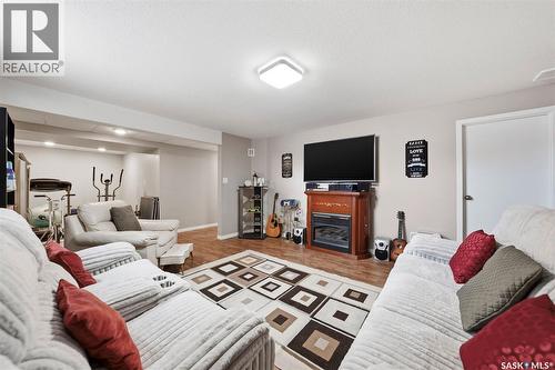 10 Meadows Place, Watrous, SK - Indoor Photo Showing Living Room With Fireplace