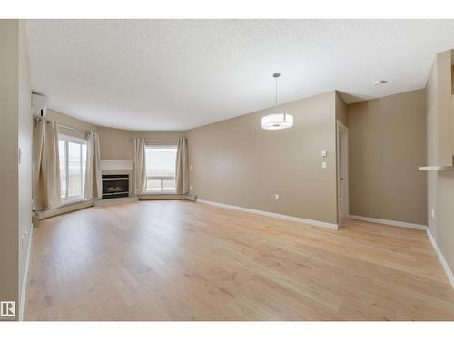 #232 15499 Castle Downs Rd Nw, Edmonton, AB - Indoor Photo Showing Living Room With Fireplace